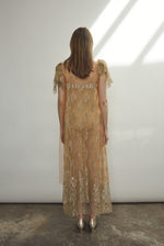 Rear view of Kamperett Moony Lace Gown — black silk button closure at center back neck, unlined French lace, clean straight-cut silhouette. Made in California.