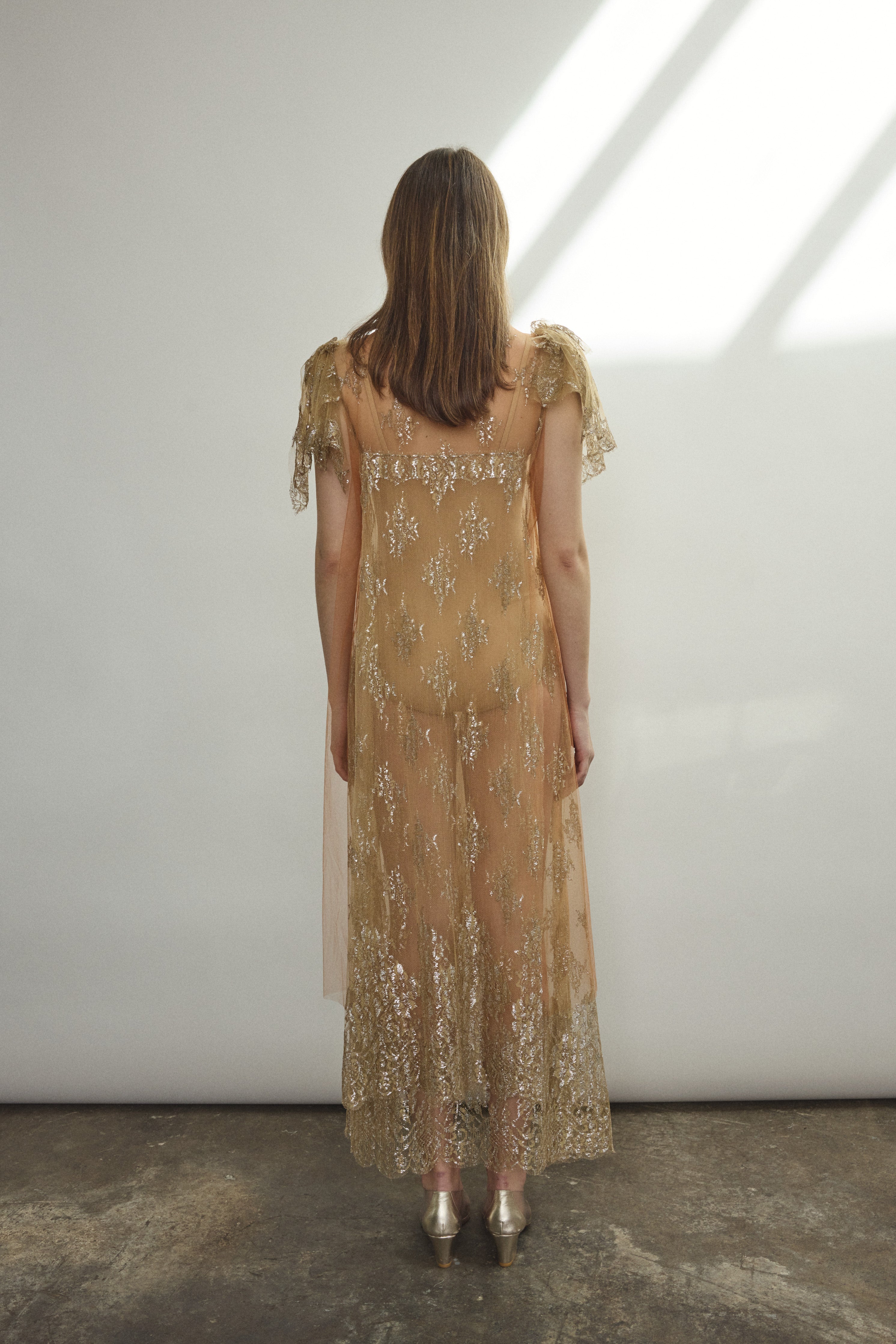 Rear view of Kamperett Moony Lace Gown — black silk button closure at center back neck, unlined French lace, clean straight-cut silhouette. Made in California.