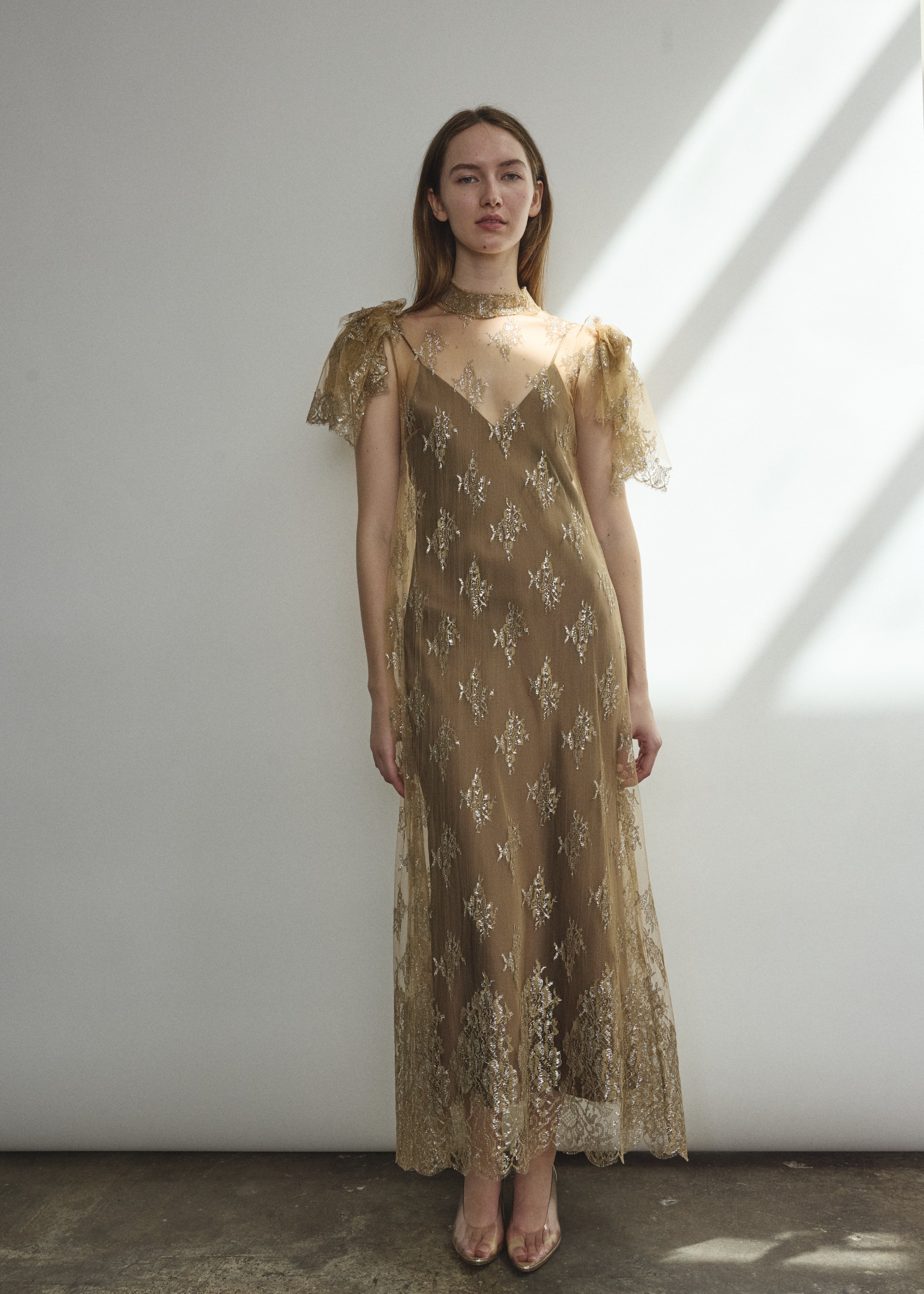 Full-length front view of mink French lace mock neck sheath gown with deconstructed cap sleeves and straight-cut silhouette, made in California.