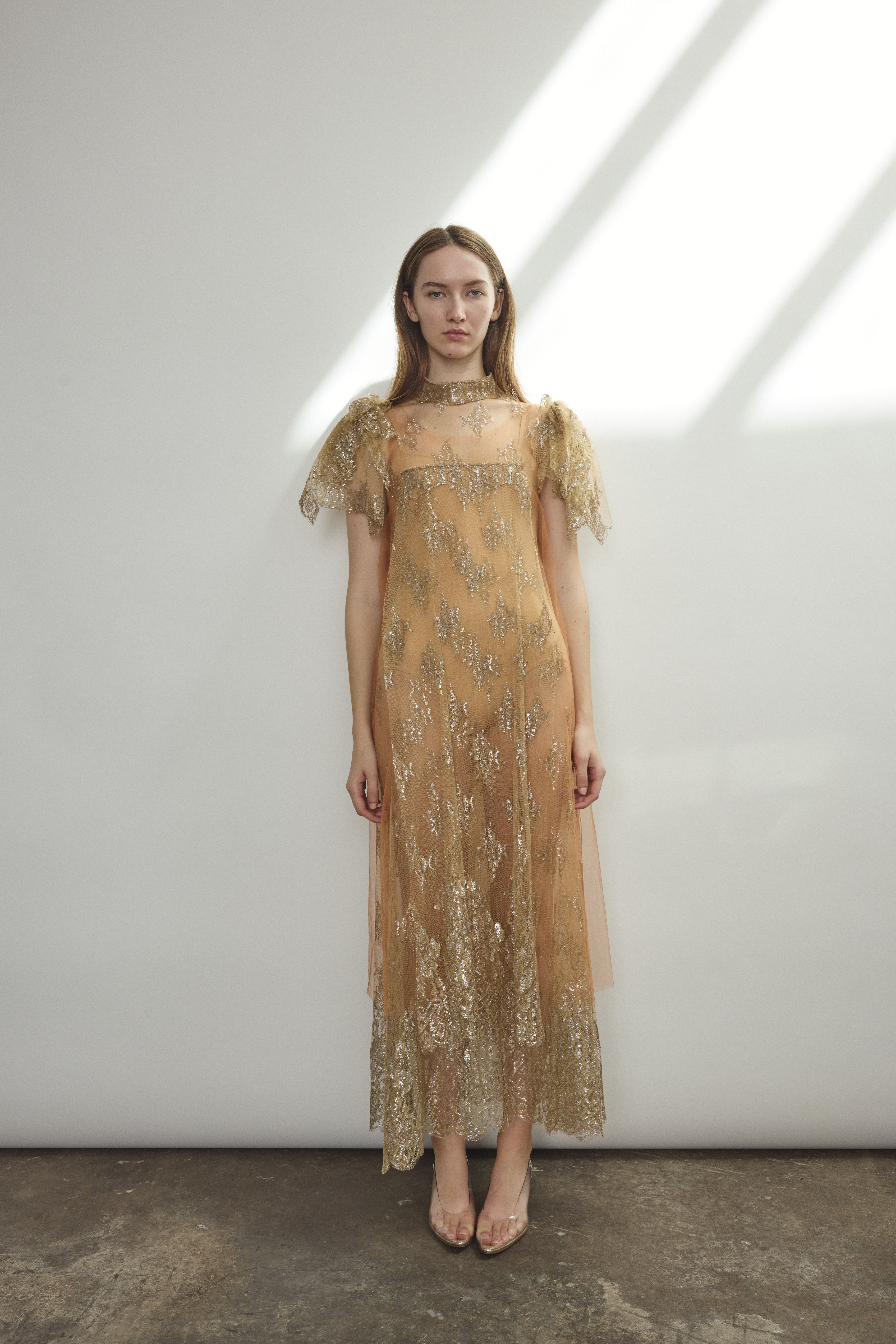 Full-length front view of mink French lace mock neck sheath gown with deconstructed cap sleeves and straight-cut silhouette, made in California.
