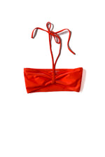 Flat image of the coral Italian regenerated nylon Kamperett Orra Bandeau Top.