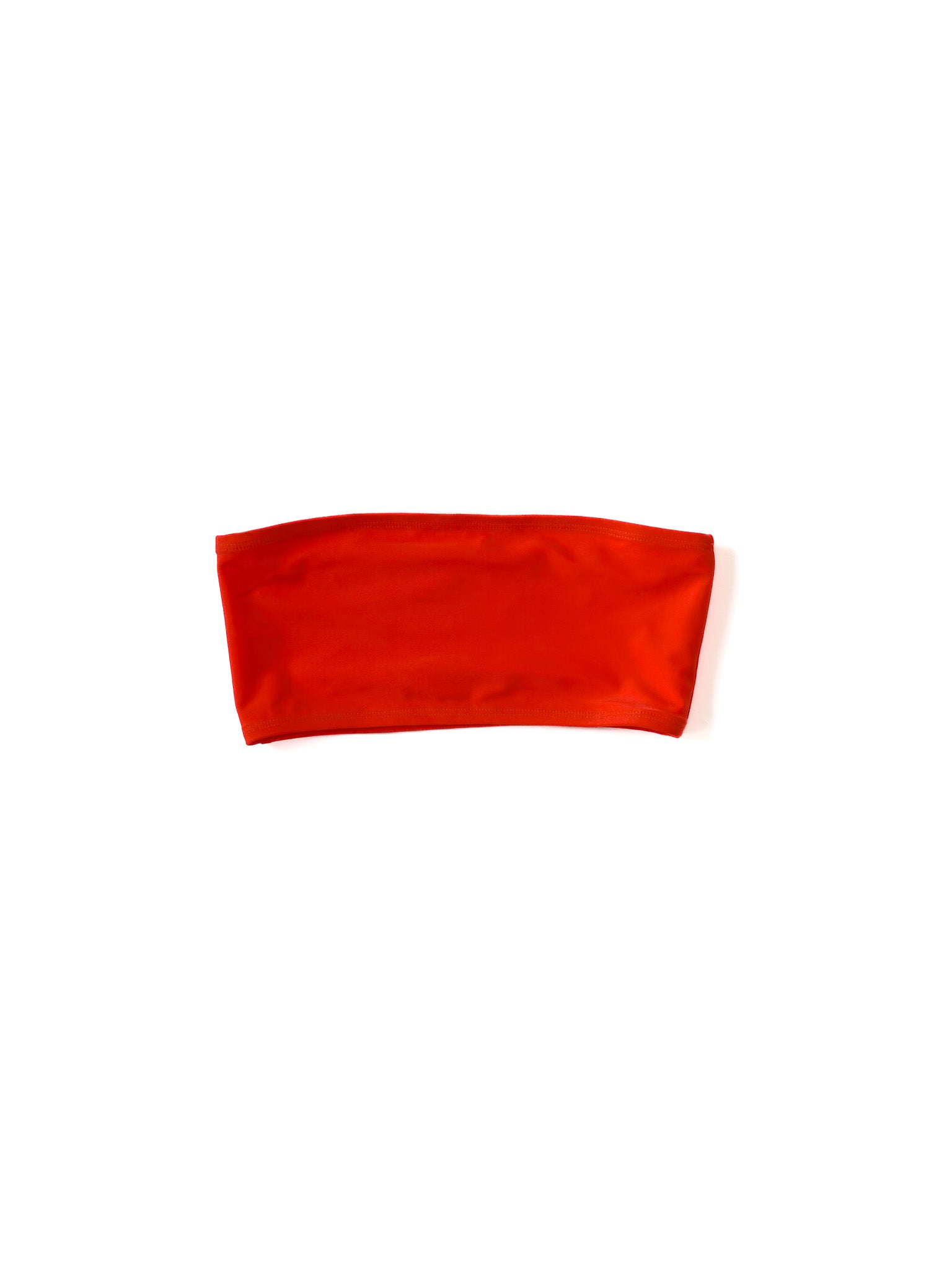 Alternate flat image of the coral Kamperett Orra Bandeau Top with halter cord attached.