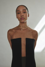 Editorial image of the black crepe Kamperett Pirie Shift Dress.
