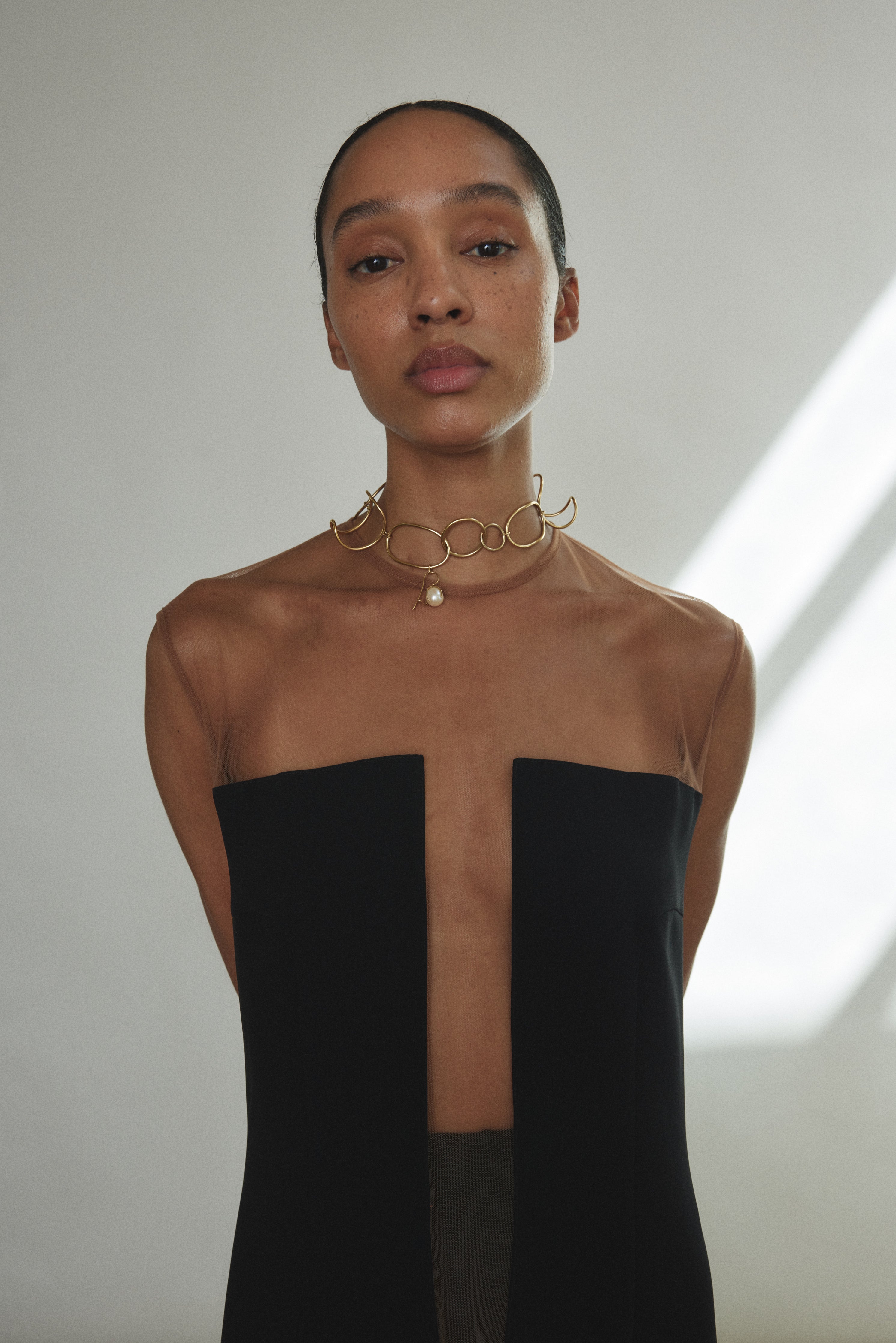 Editorial image of the black crepe Kamperett Pirie Shift Dress.