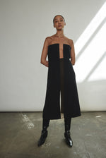 Front view of a model wearing the black crepe Kamperett Pirie Shift Dress, with sheer tulle illusion panel at neckline and shoulders.