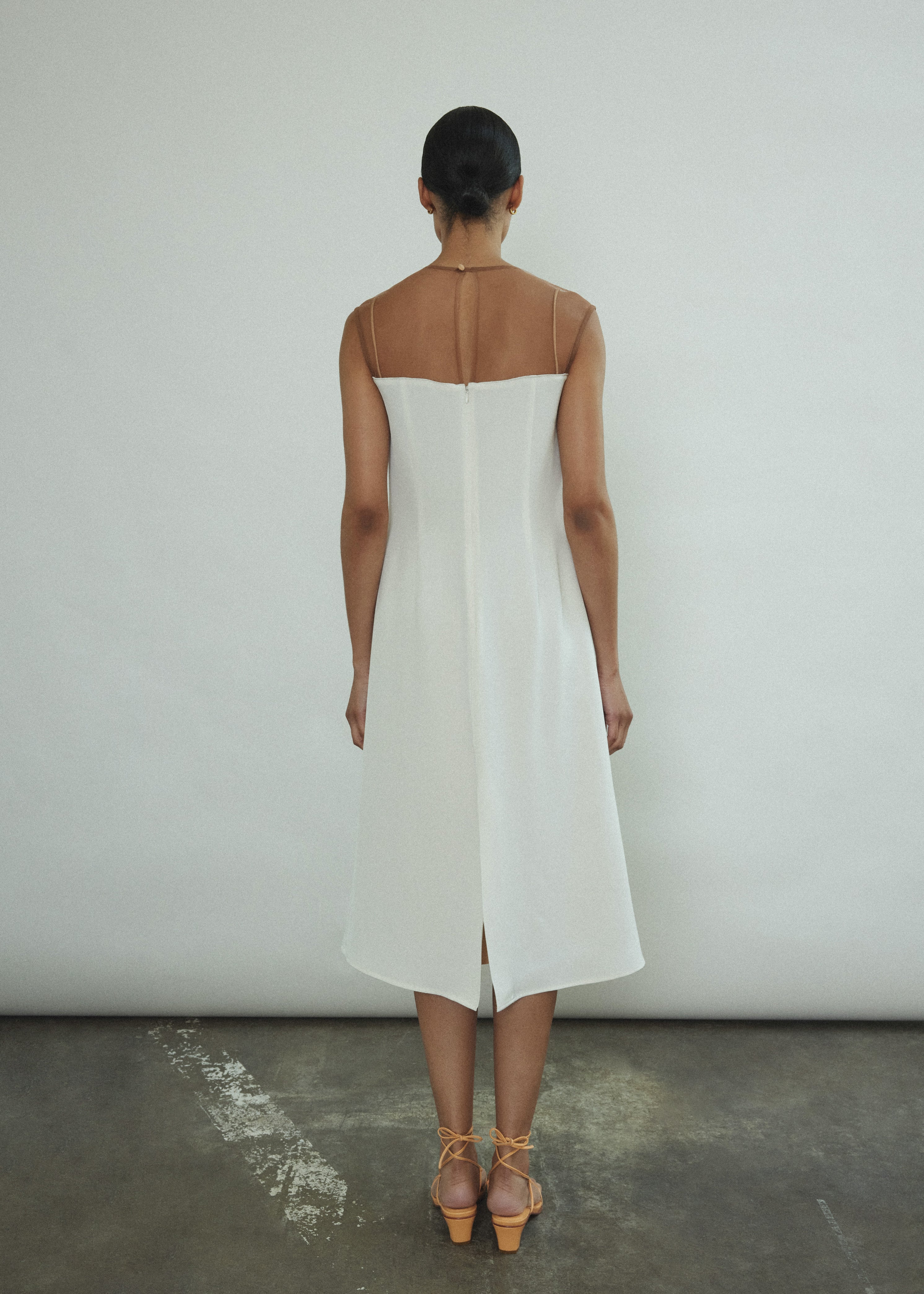 The ivory silk Kamperett Pirie Shift Dress styled layered over a slip or with the Leona Skirt or Huene Pant.