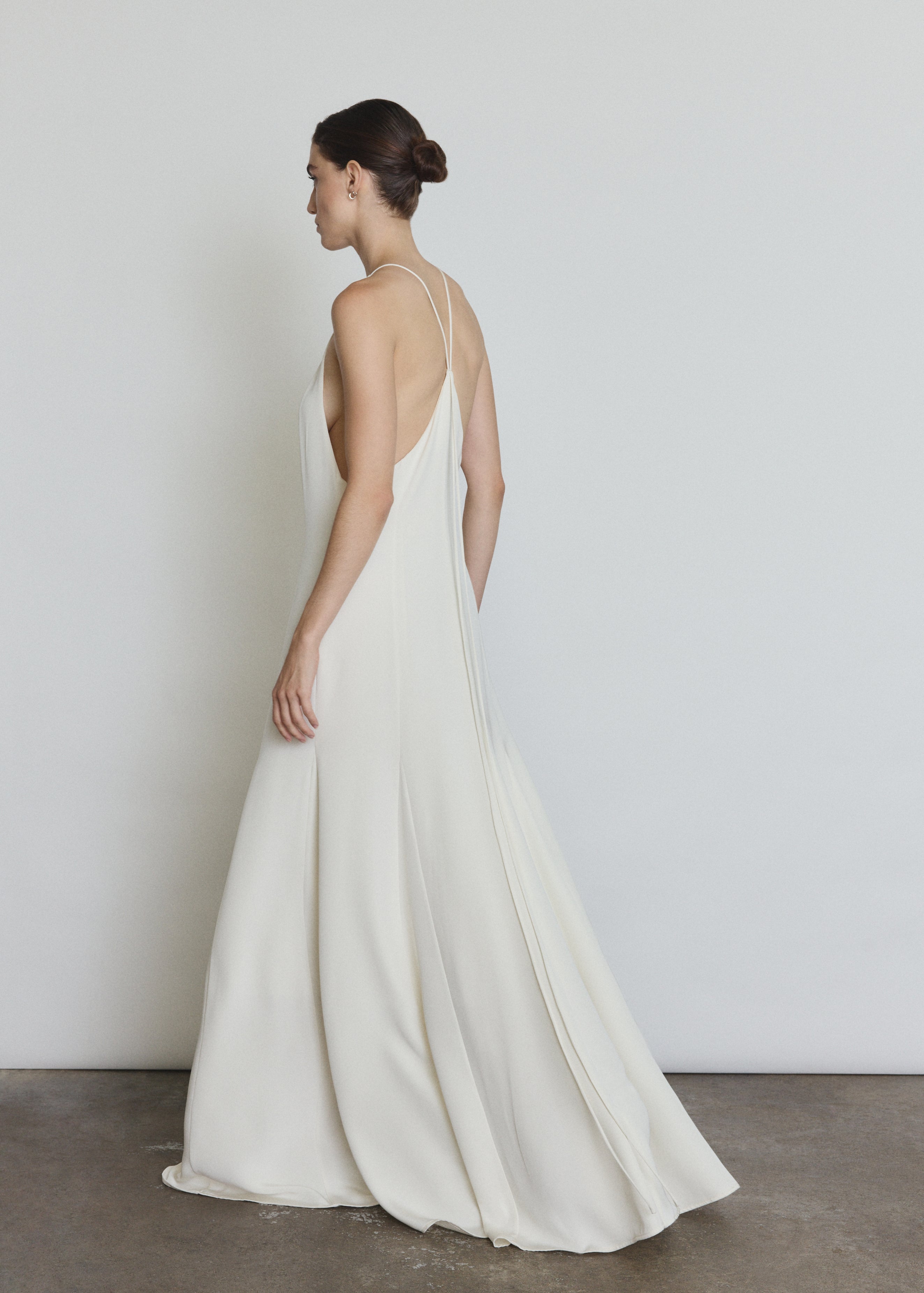 Back view of the alabaster silk crepe Kamperett Ray Gown showing the sun-ray pattern at center back.