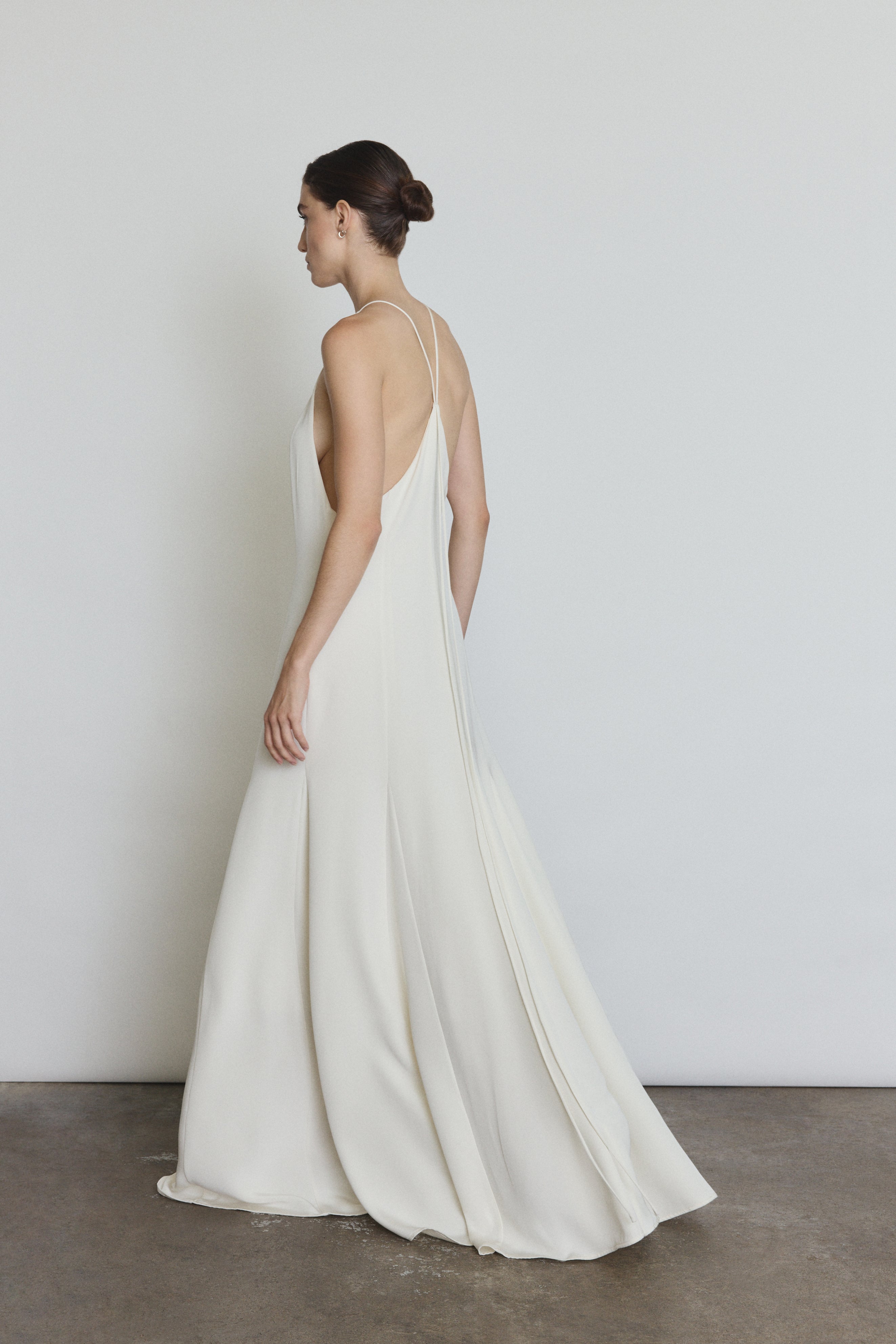Back view of the alabaster silk crepe Kamperett Ray Gown showing the sun-ray pattern at center back.