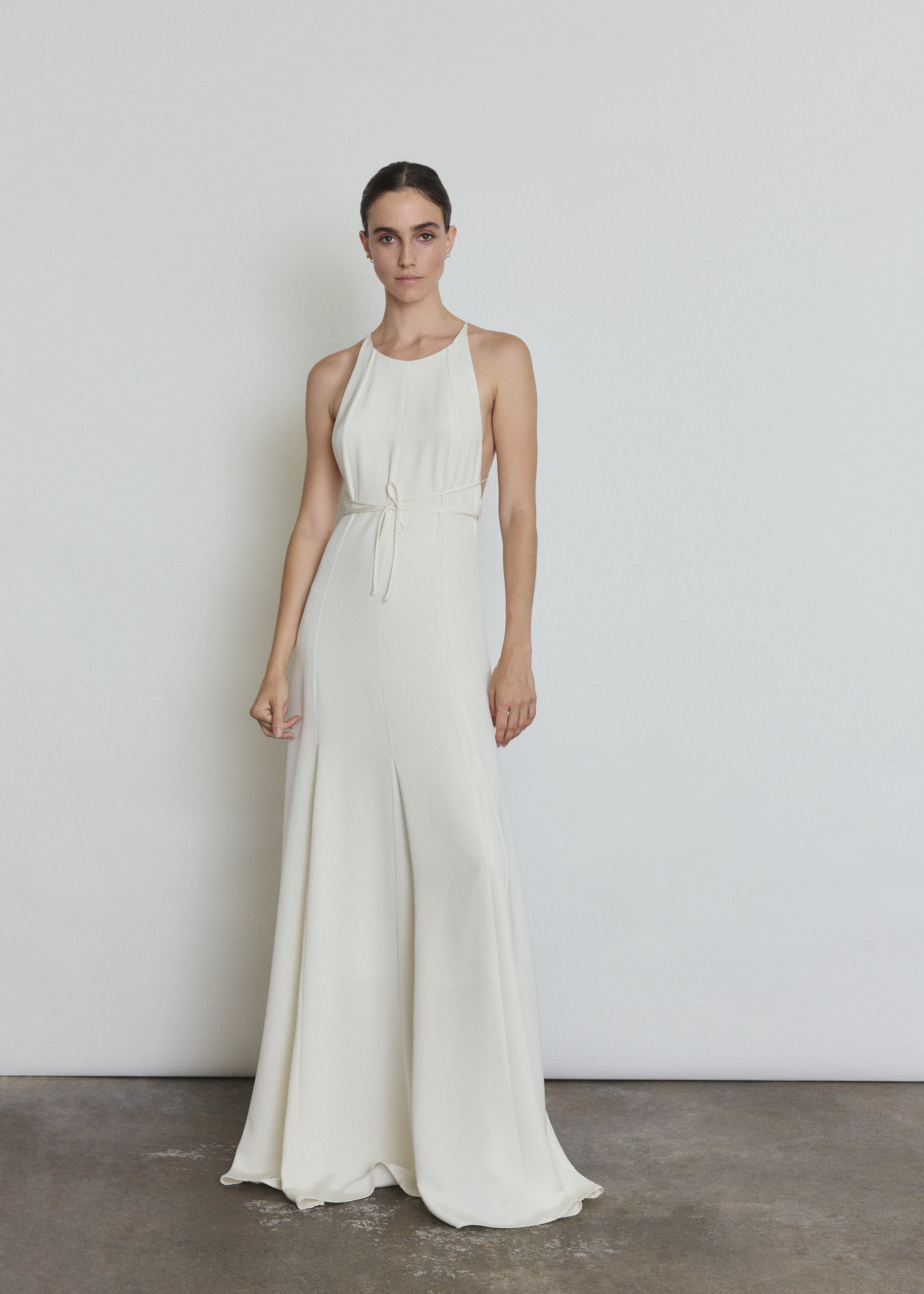 Detail of the alabaster silk crepe Kamperett Ray Gown showing the halter-neck construction and back straps.