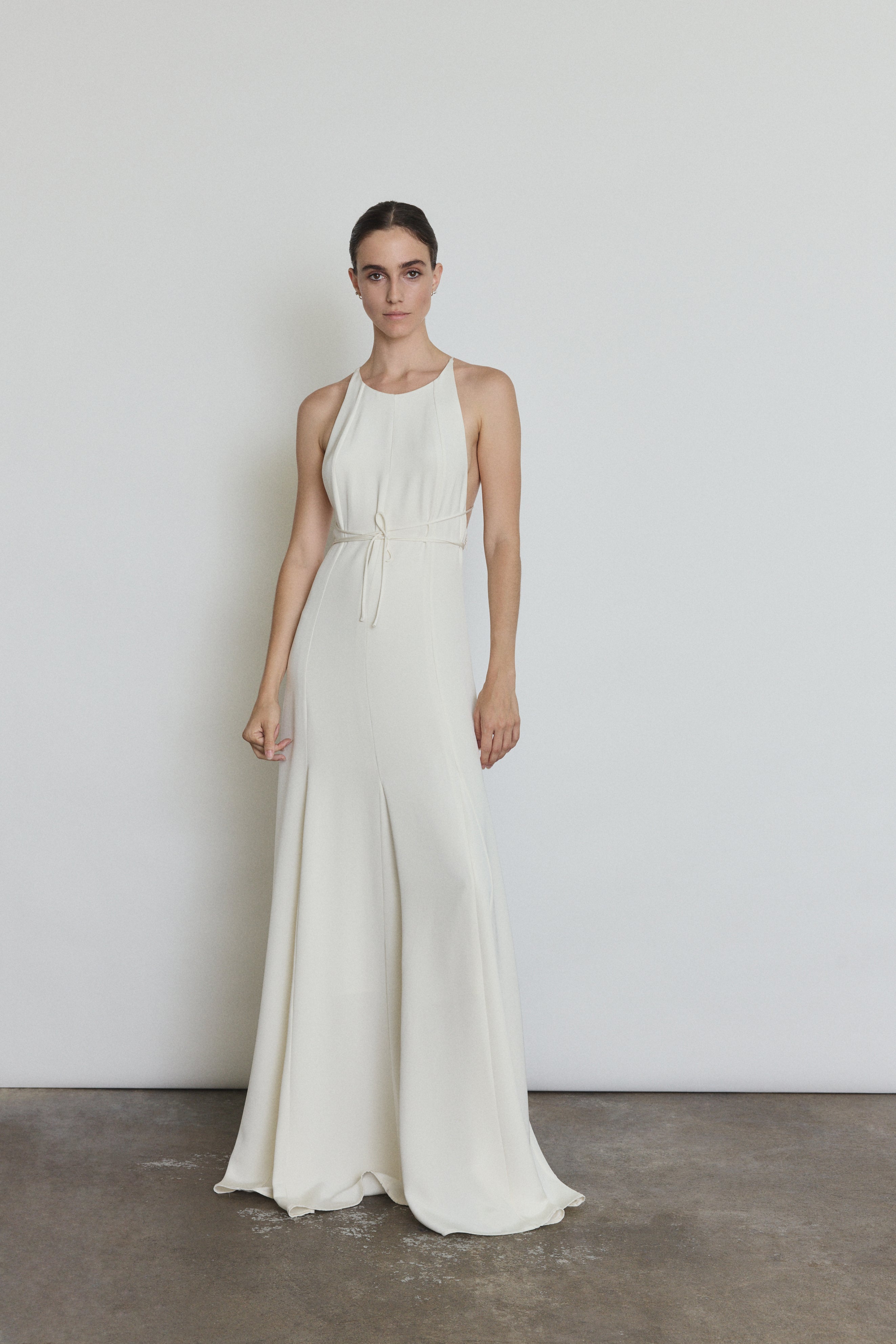 Detail of the alabaster silk crepe Kamperett Ray Gown showing the halter-neck construction and back straps.