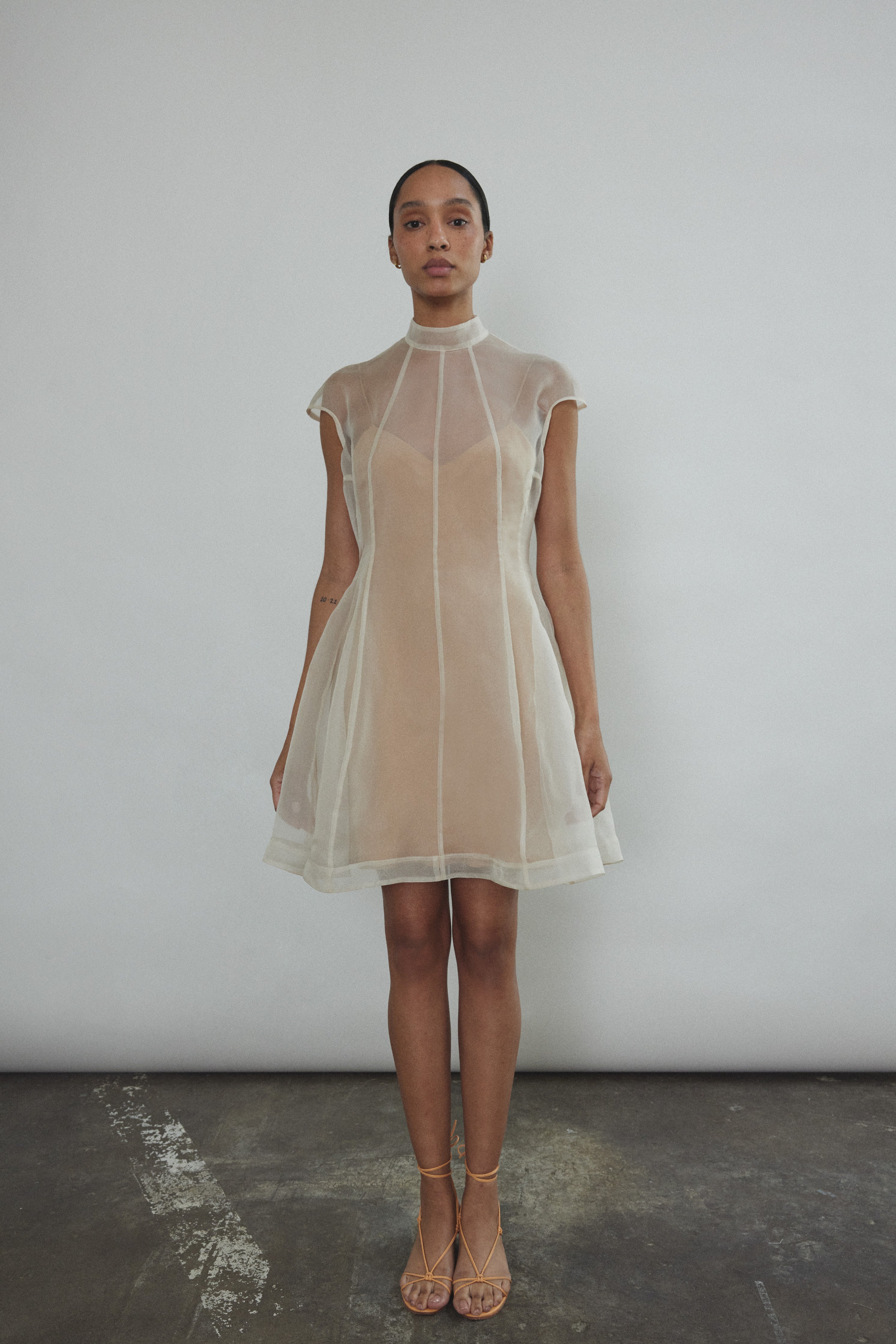 Back view of the ivory silk organza Kamperett Reine Dress with invisible zip closure.