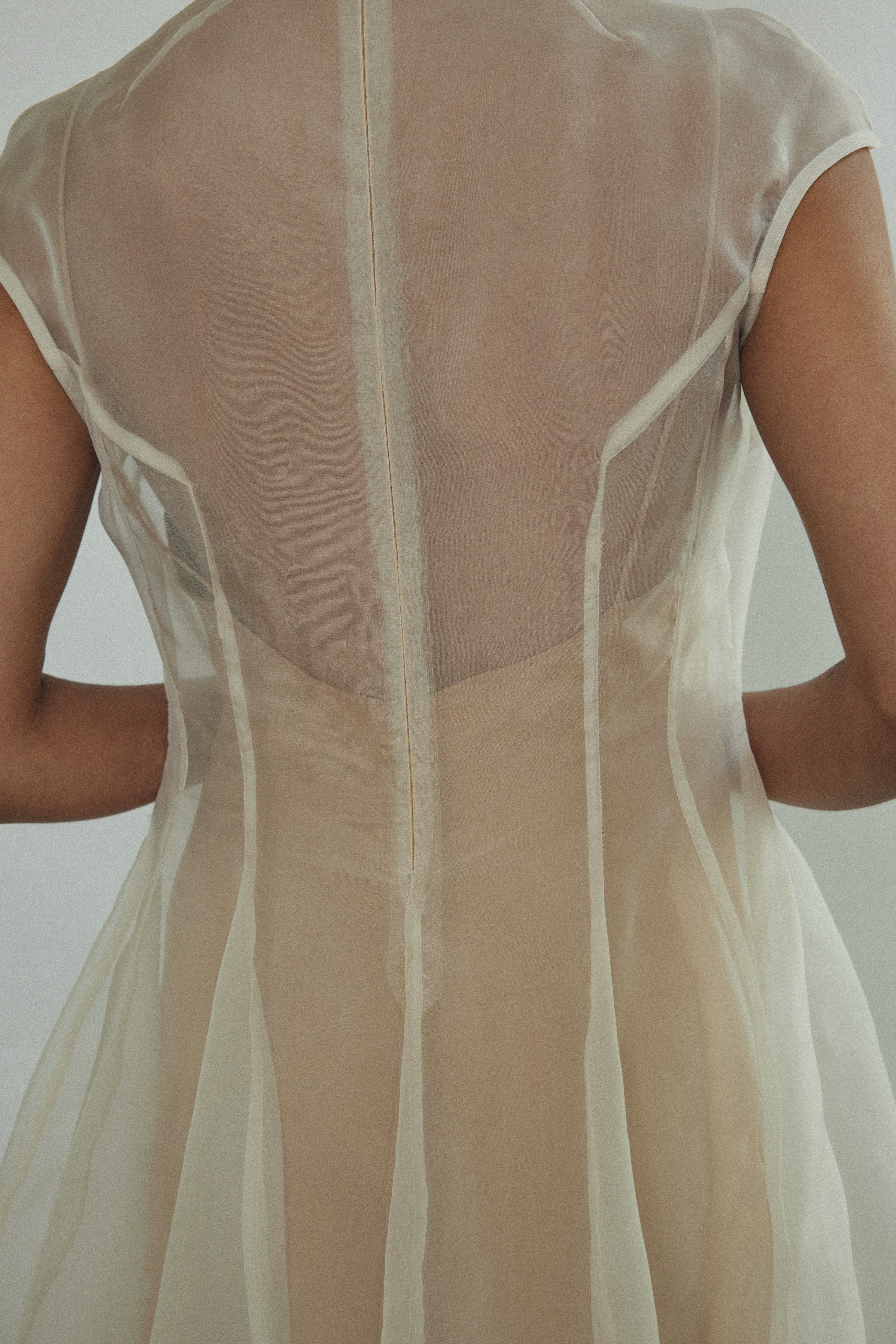 Back-angled view of the ivory silk organza Kamperett Reine Dress.