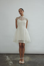 Editorial image of a bride wearing the ivory silk organza Kamperett Reine Dress.