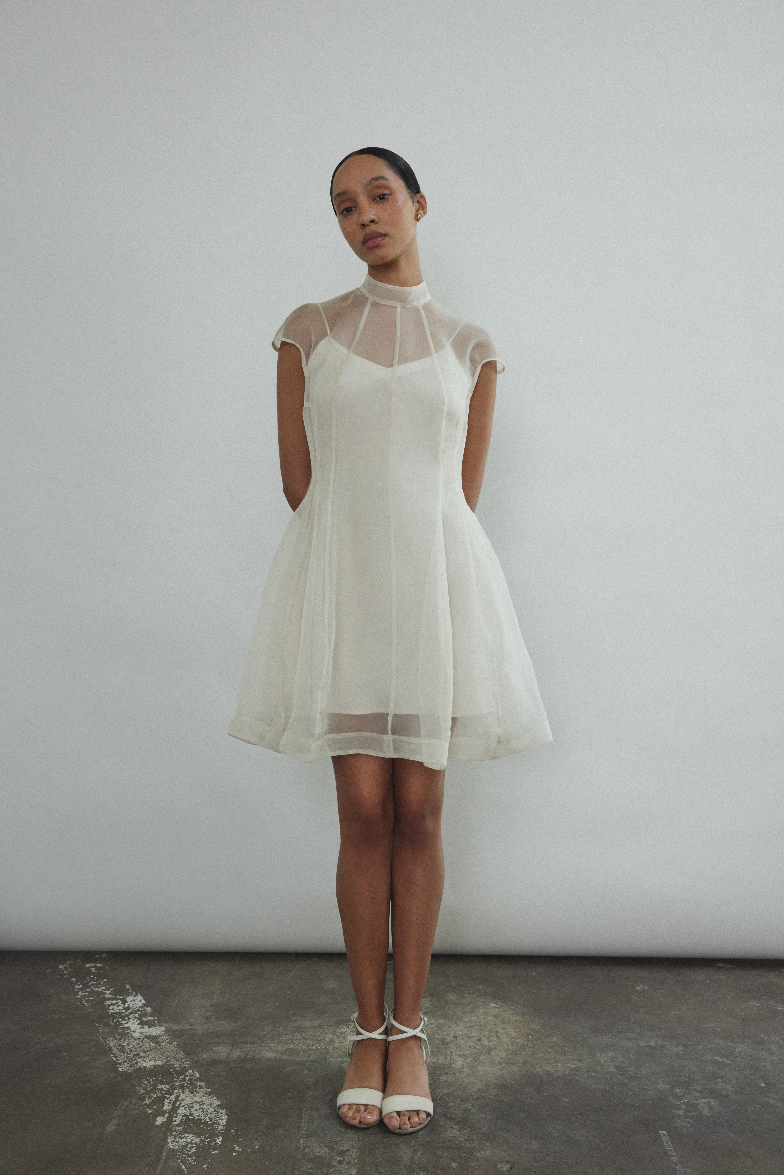 Editorial image of a bride wearing the ivory silk organza Kamperett Reine Dress.