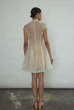 Detail of the mock neck and sculpted seaming on the ivory silk organza Kamperett Reine Dress.