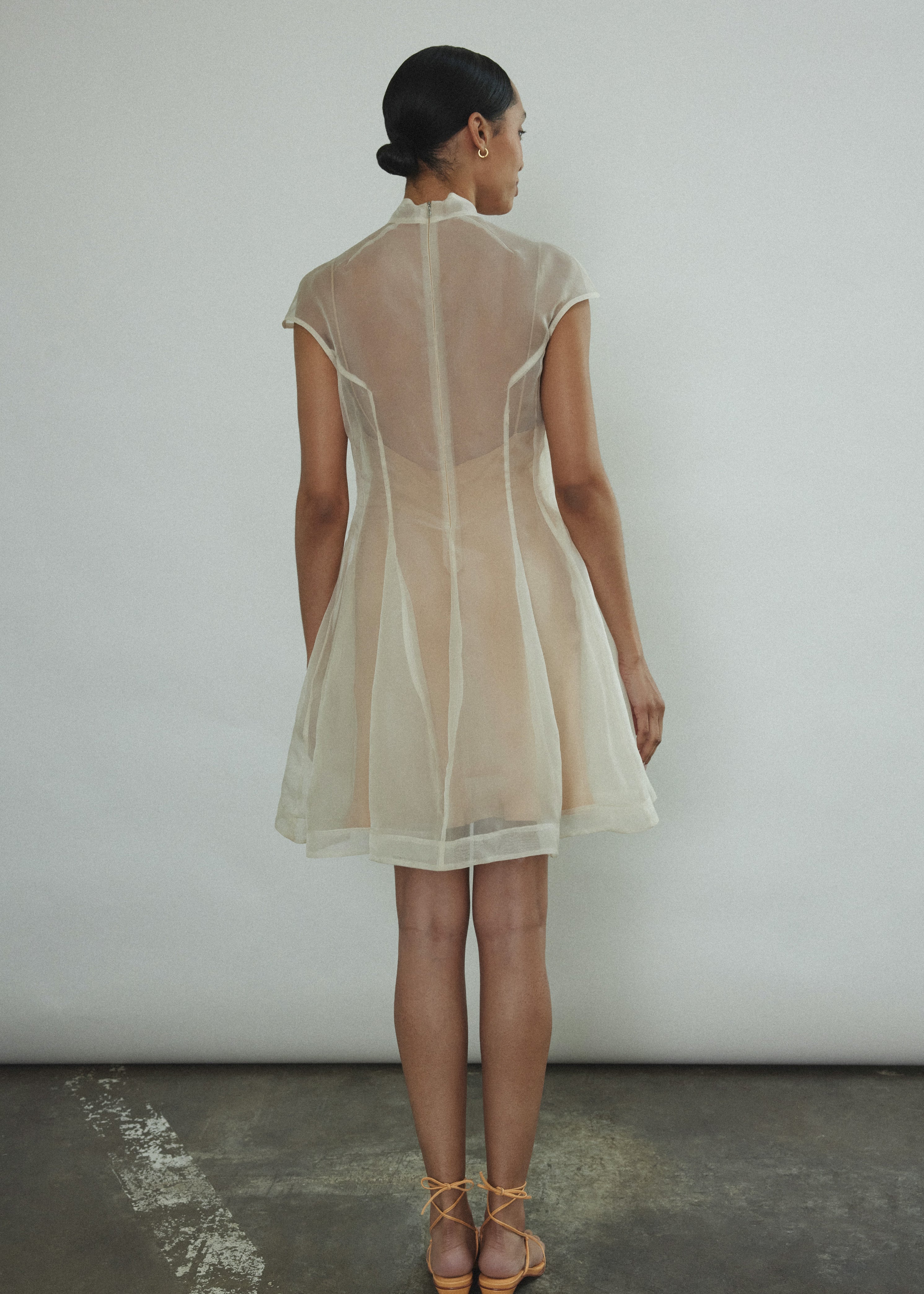 Detail of the mock neck and sculpted seaming on the ivory silk organza Kamperett Reine Dress.