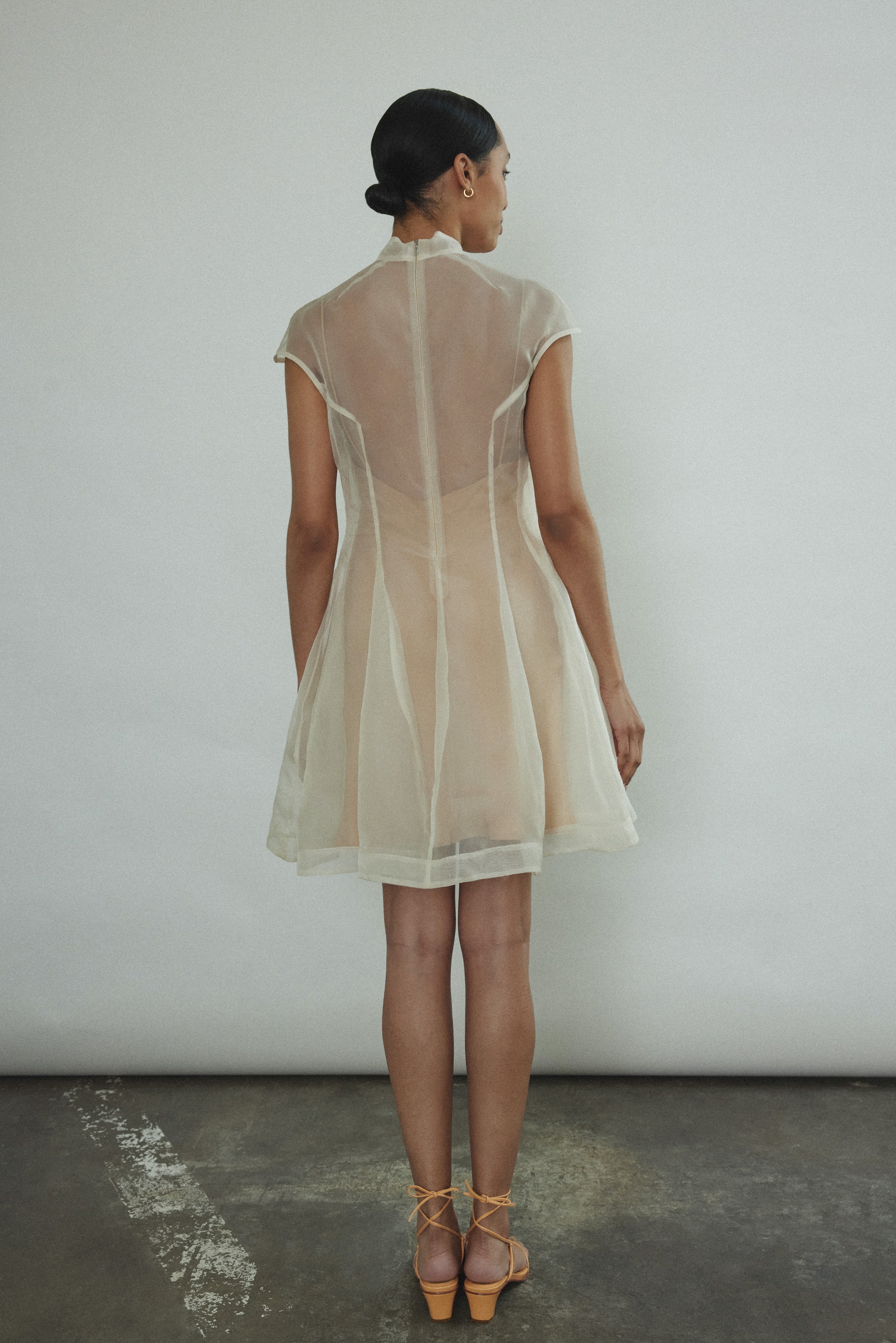 Detail of the mock neck and sculpted seaming on the ivory silk organza Kamperett Reine Dress.
