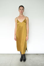 Detail of the corded straps on the brass silk charmeuse Kamperett Sade Slip Dress.