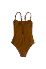 Flat back view of the camel Italian regenerated nylon Kamperett Selwood One Piece showing the deep V.