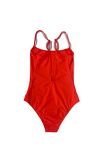 Flat back view of the coral Italian regenerated nylon Kamperett Selwood One Piece showing the deep V.