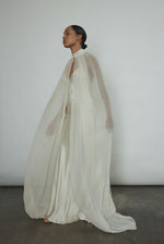 Editorial image of a bride wearing the ivory silk chiffon Kamperett Choker Cape.