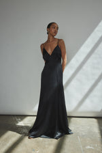 Detail of the sheer diamond-shaped panels on the black silk charmeuse Kamperett Simone Slip Dress.
