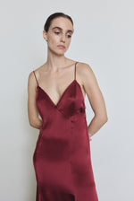 Detail of the bordeaux Kamperett Simone Slip Dress showing the sheer organza back panel and corded strap construction.