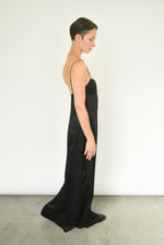 Side view of the black silk charmeuse Kamperett Sloan Slip showing the structured three-part cup detail.