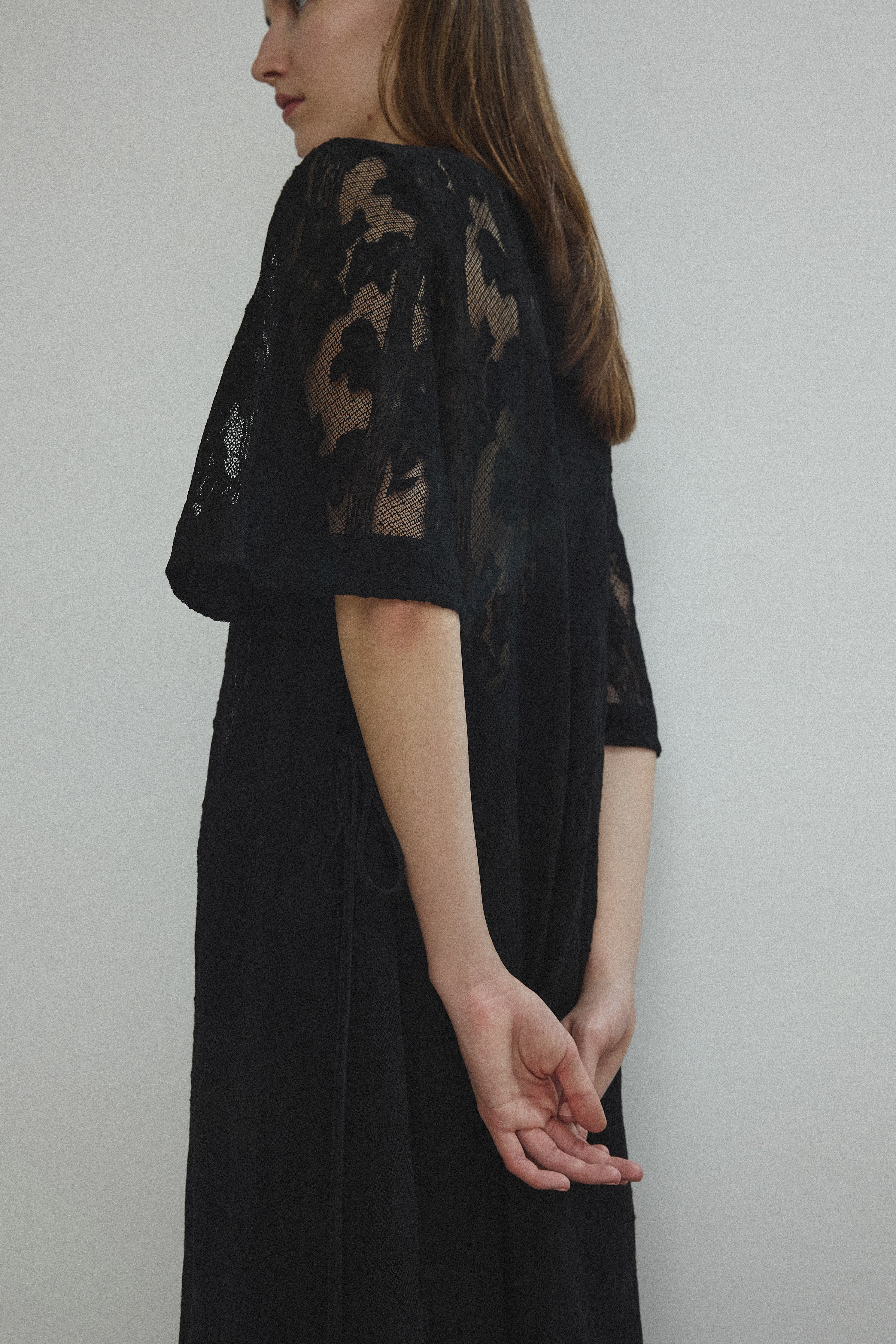 Detail of the eyelash lace hem on the black French lace Kamperett Thea Lace Sheath Dress.