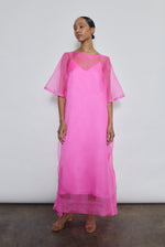 Hot pink silk organza midi dress with raw edge neckline and self corded ties. Effortless sheath silhouette in a vivid, luminous hue. Handcrafted in California.