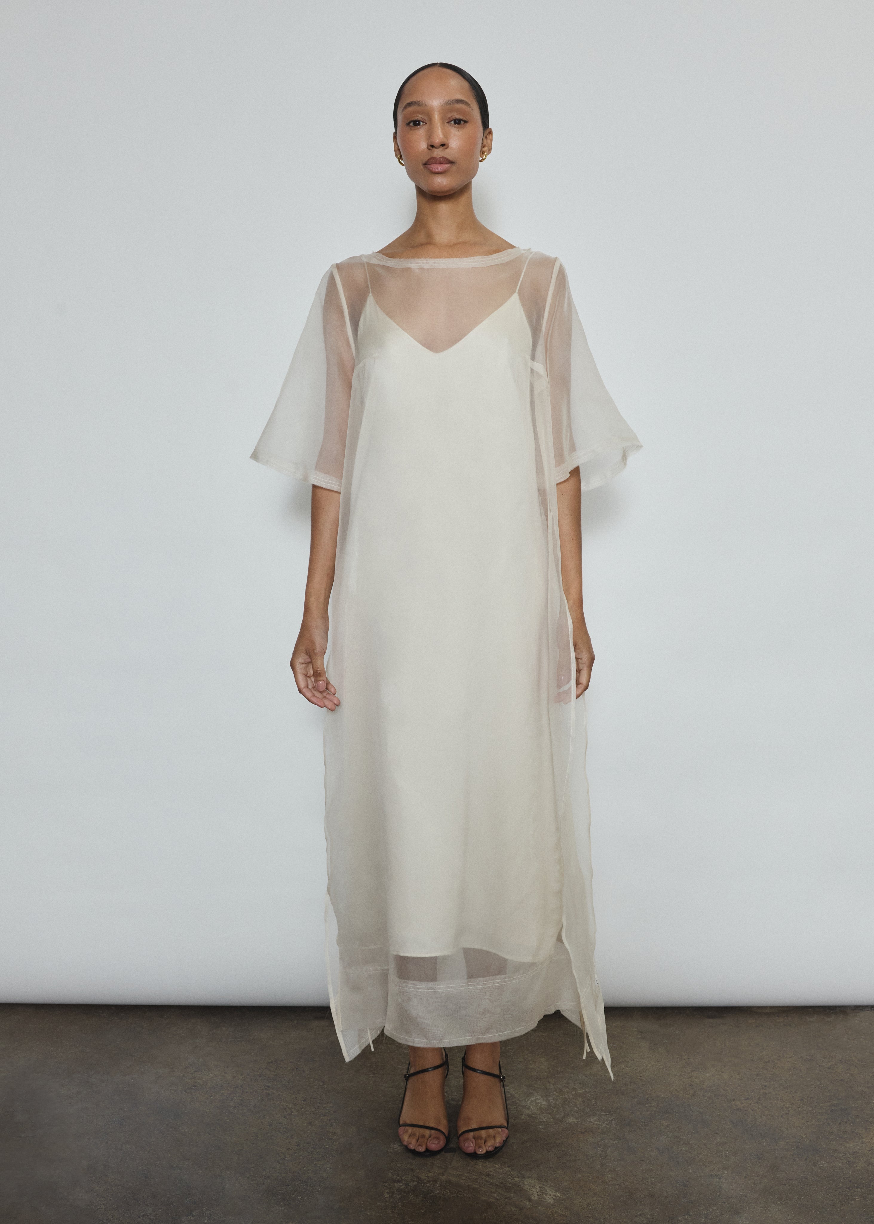 Ivory silk organza midi sheath dress, straight-cut silhouette with raw edge neckline and wide hem facing, handcrafted in California.