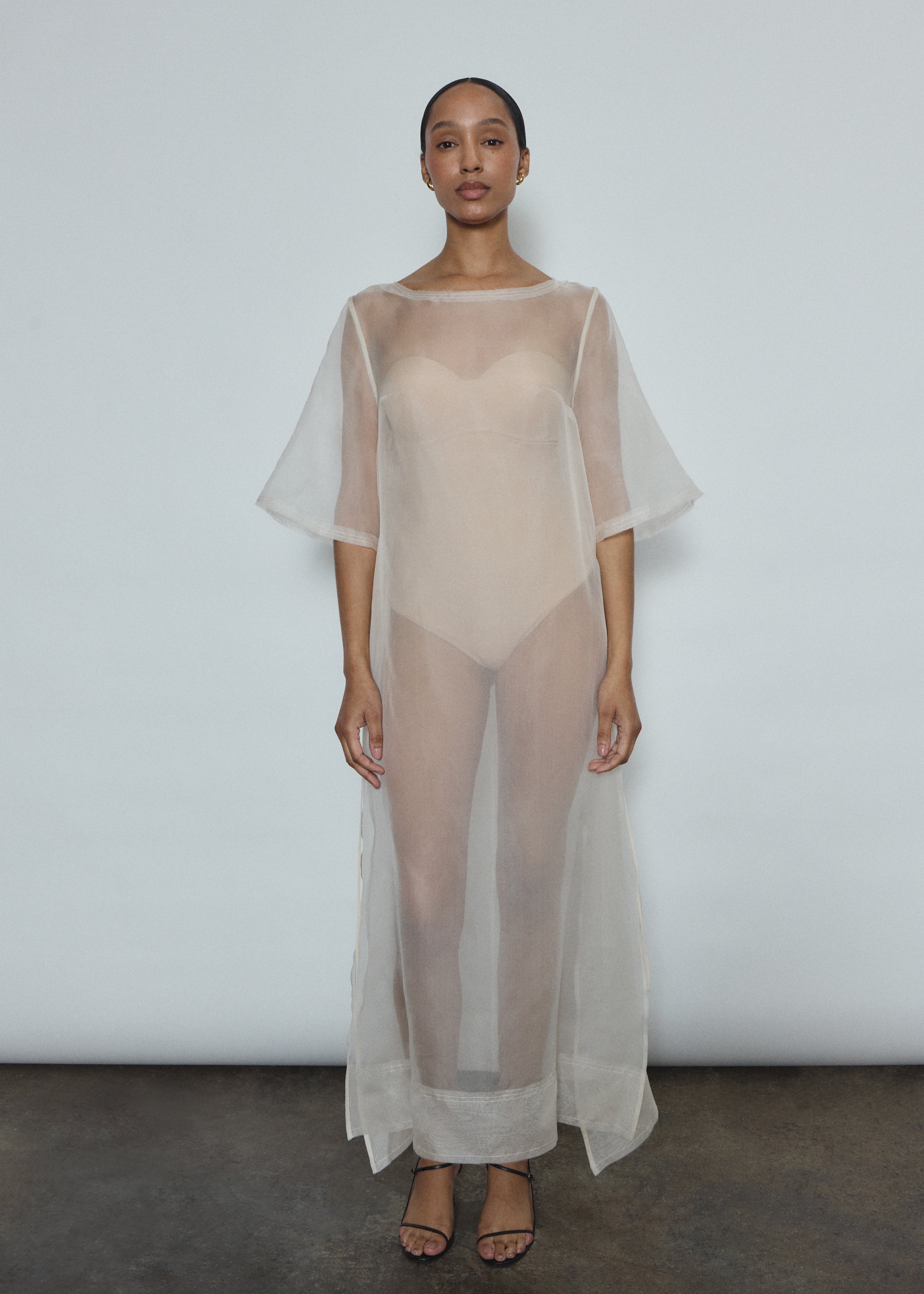 Ivory silk organza midi dress with raw edge neckline and self corded ties. Minimalist sheath silhouette, handcrafted in California. Effortless luxury occasion wear.