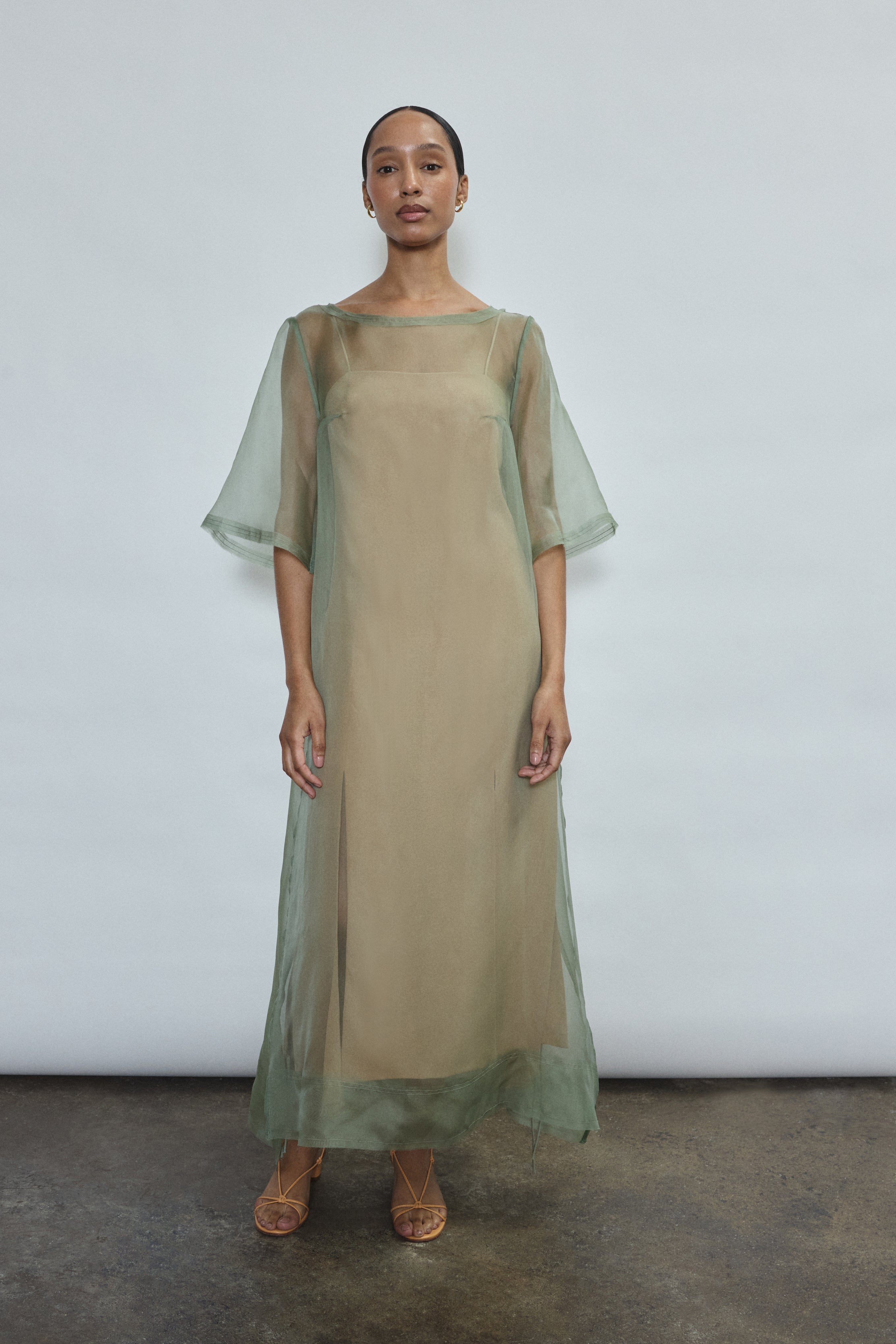 Jade silk organza midi dress with raw edge neckline and self corded ties. Architectural sheath silhouette in a cool, luminous green. Handcrafted in California.