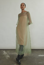 Jade silk organza midi dress with raw edge neckline and self corded ties. Architectural sheath silhouette in a cool, luminous green. Handcrafted in California.