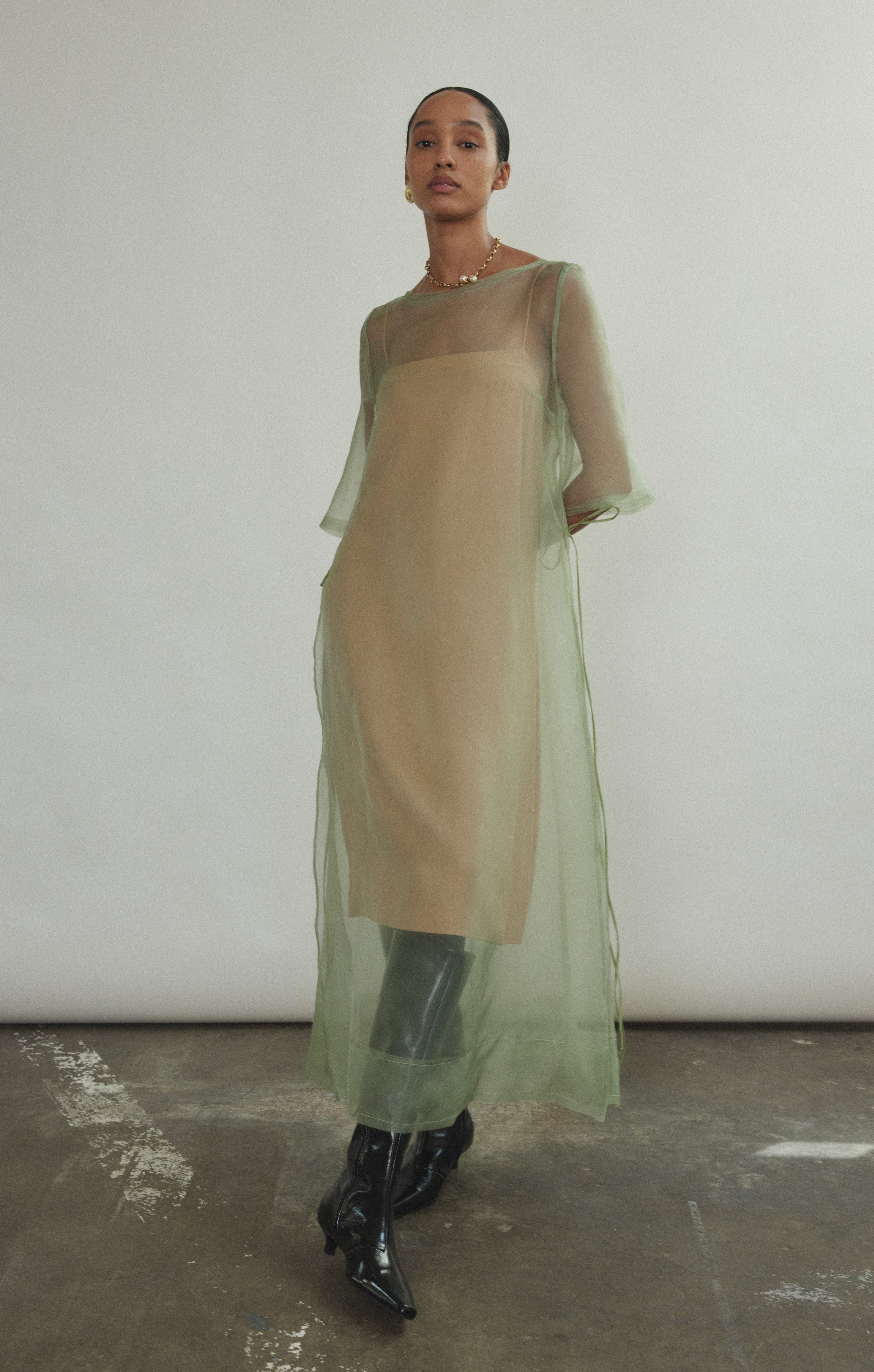 Jade silk organza midi dress with raw edge neckline and self corded ties. Architectural sheath silhouette in a cool, luminous green. Handcrafted in California.