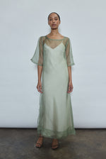 Jade silk organza midi dress with raw edge neckline and self corded ties. Architectural sheath silhouette in a cool, luminous green. Handcrafted in California.