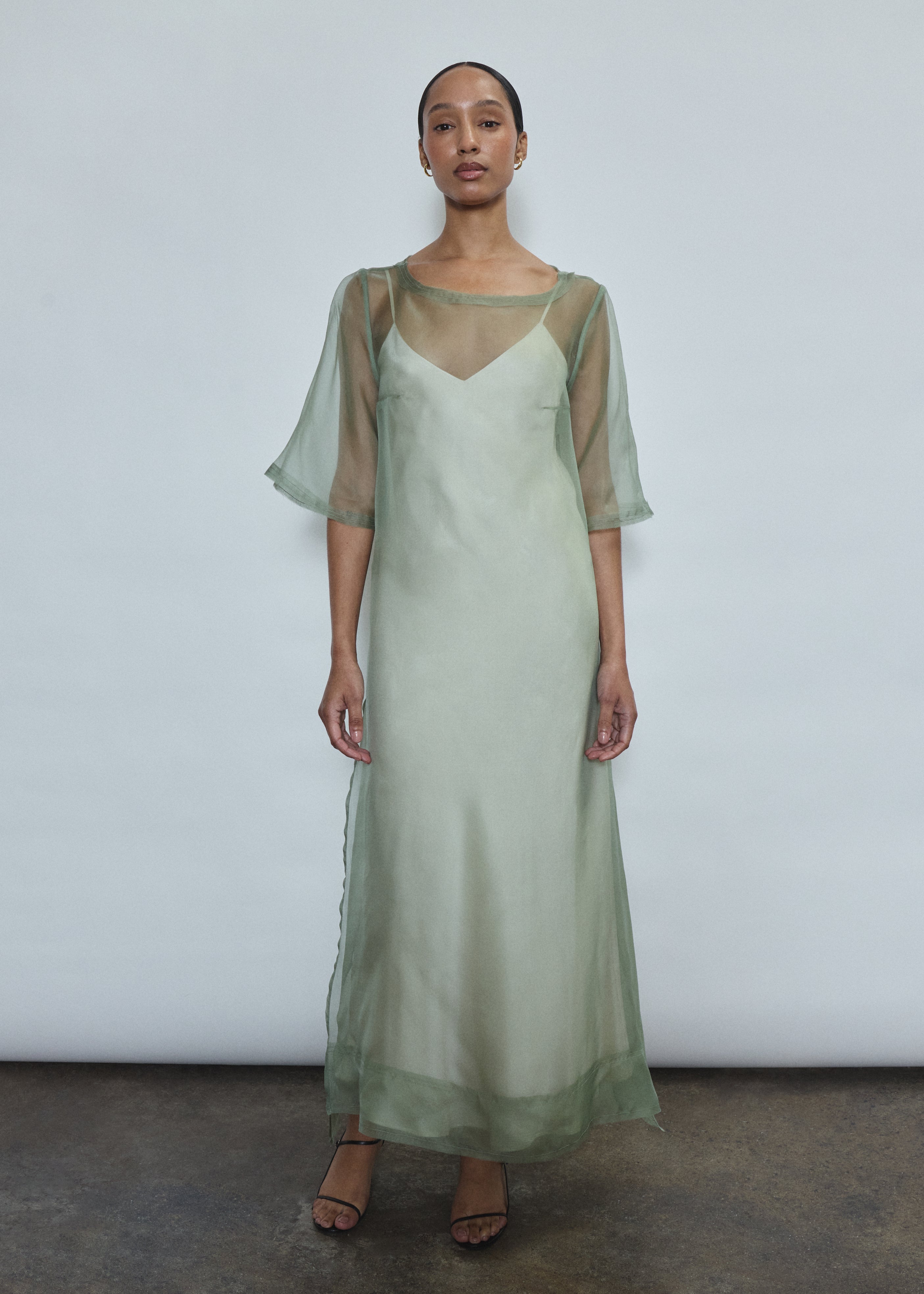Jade silk organza midi dress with raw edge neckline and self corded ties. Architectural sheath silhouette in a cool, luminous green. Handcrafted in California.