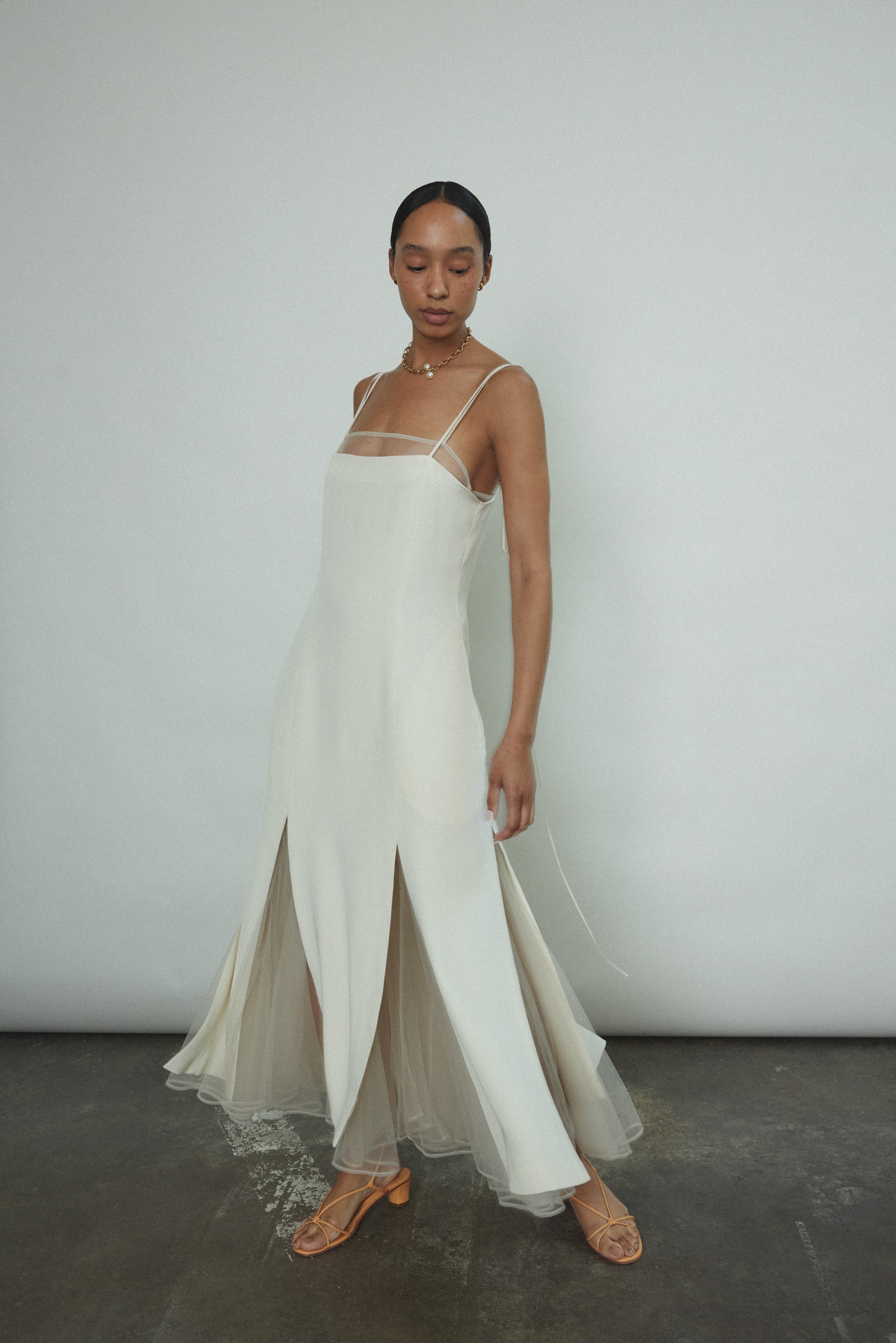Detail editorial of the alabaster silk crepe Kamperett Theodora Dress.