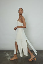 Editorial image of the alabaster silk crepe Kamperett Theodora Dress.