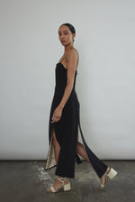 Editorial image of the black crepe Kamperett Theodora Dress with silk charmeuse lining.