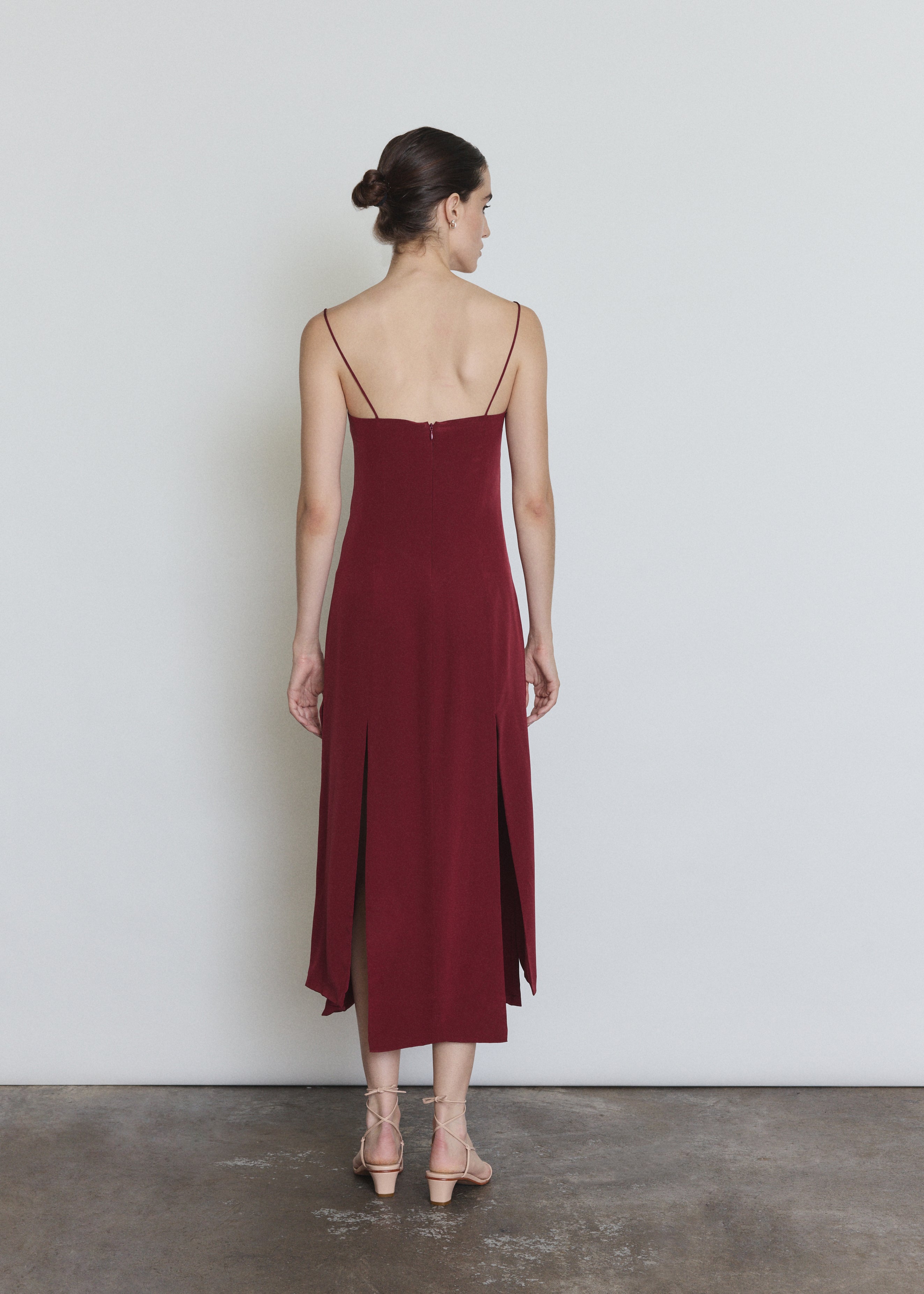 Back view of the bordeaux silk Kamperett Theodora Dress showing the corded straps.