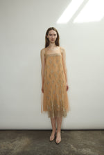 Kamperett Thistle Lace Shift in persimmon — sleeveless A-line silhouette in French lace with delicate front appliqué panel. Made in California.