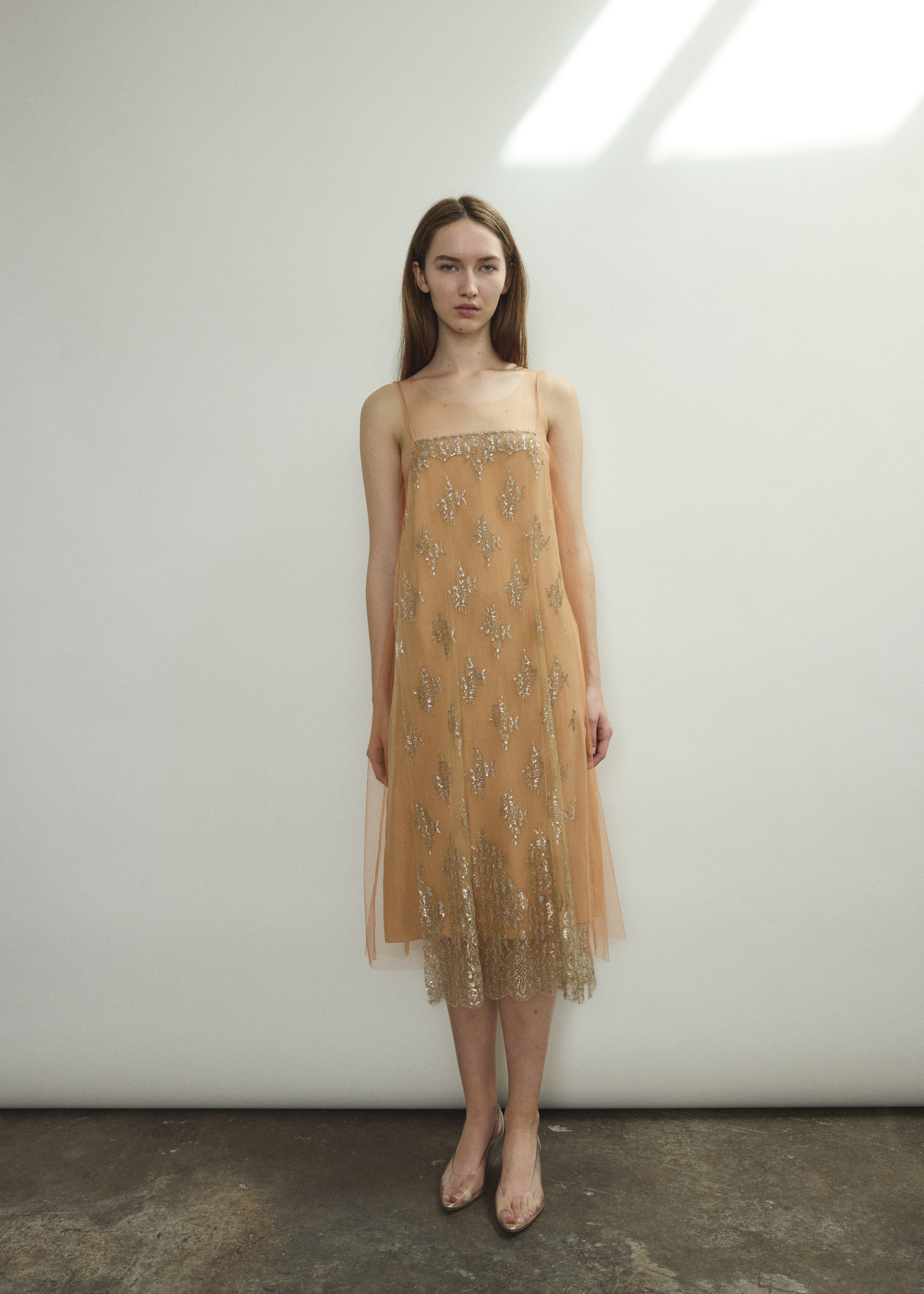 Kamperett Thistle Lace Shift in persimmon — sleeveless A-line silhouette in French lace with delicate front appliqué panel. Made in California.