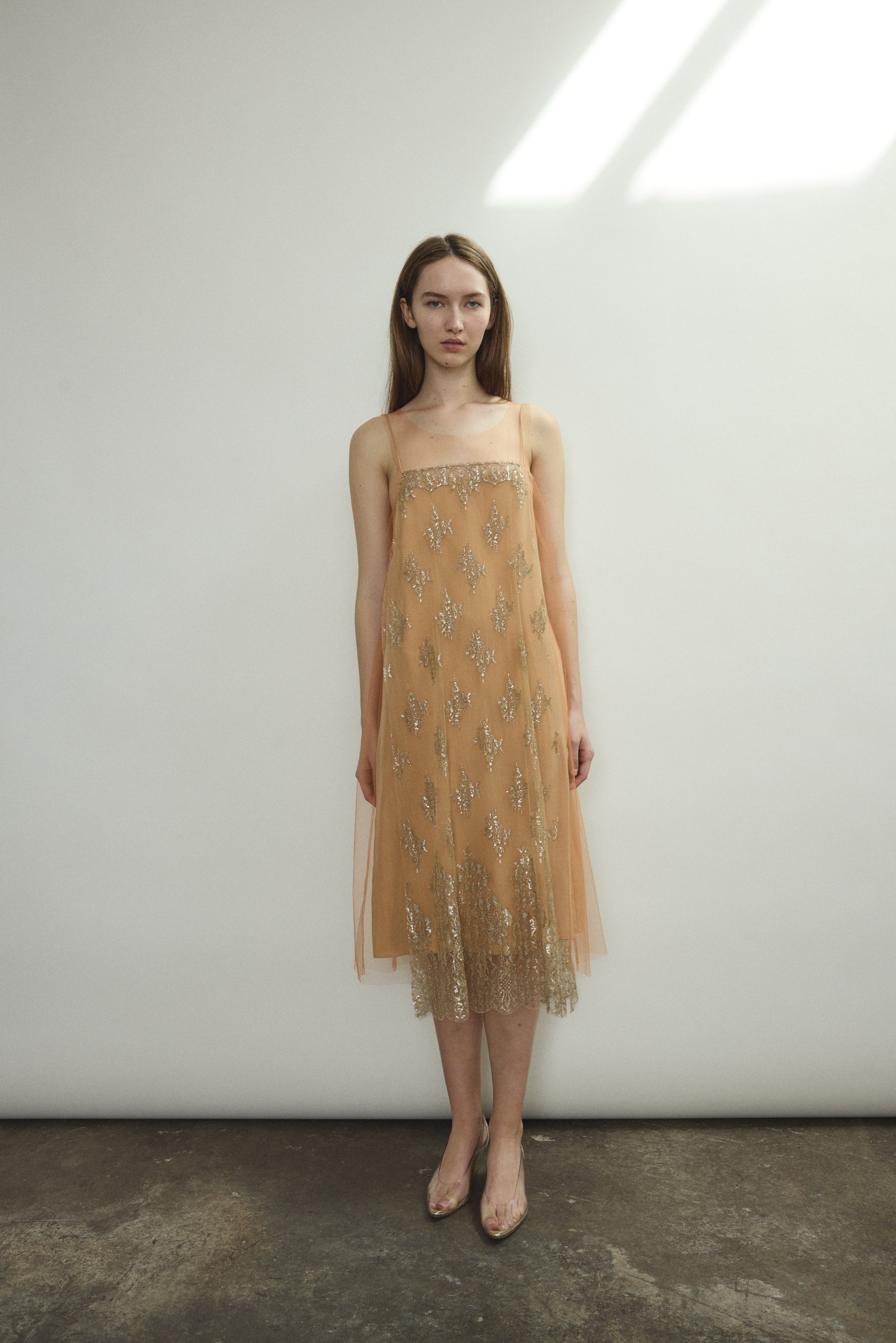 Kamperett Thistle Lace Shift in persimmon — sleeveless A-line silhouette in French lace with delicate front appliqué panel. Made in California.