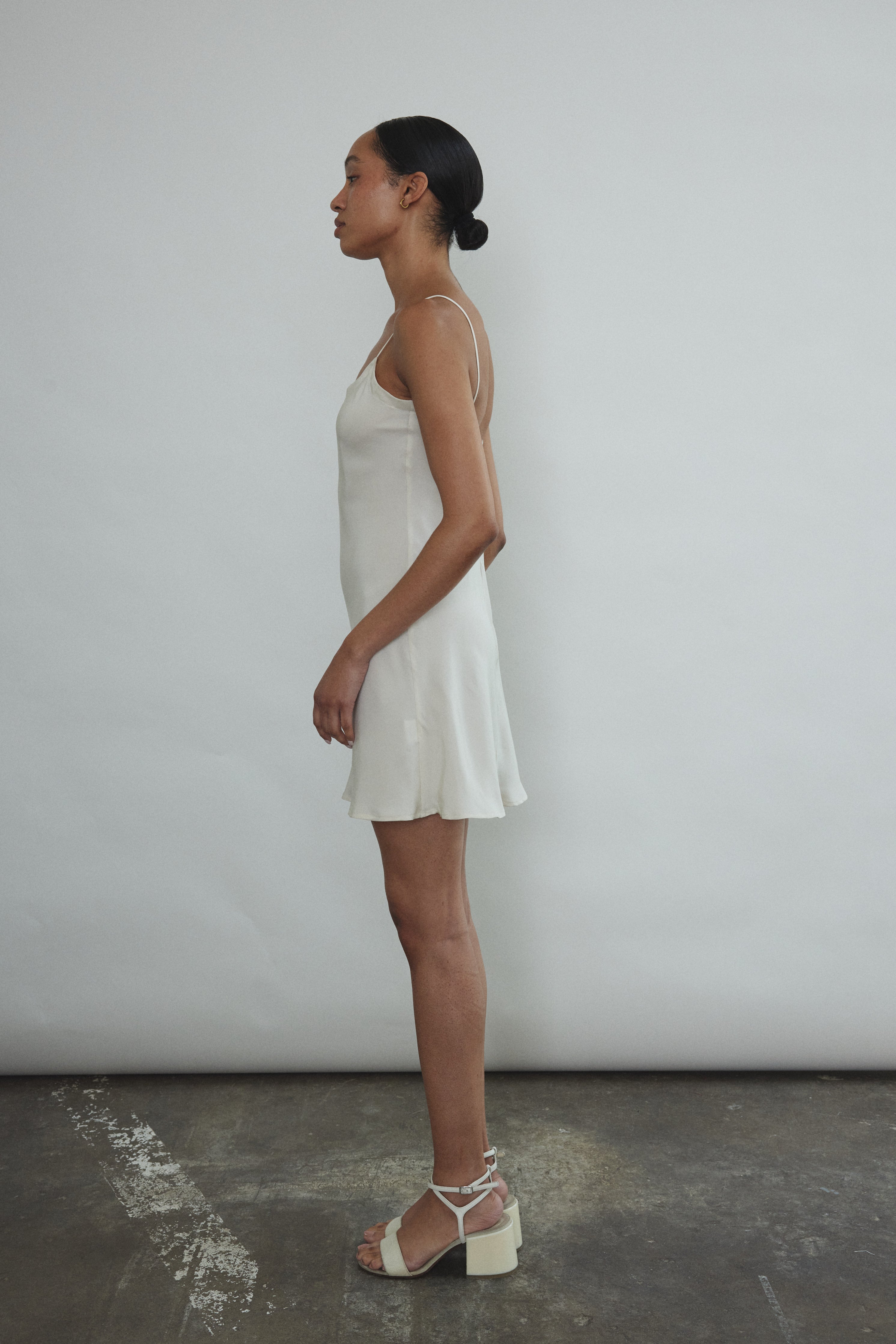 Back view of the ivory silk Kamperett V-Neck Mini Slip.