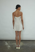 Side view of the ivory silk Kamperett V-Neck Mini Slip with V back.