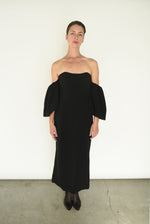 Close-up of the boned bodice and waist seaming on the black crepe Kamperett Verona Midi Dress.