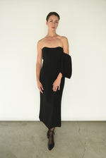The black crepe Kamperett Verona Midi Dress shown with sleeves detached, revealing the column silhouette.