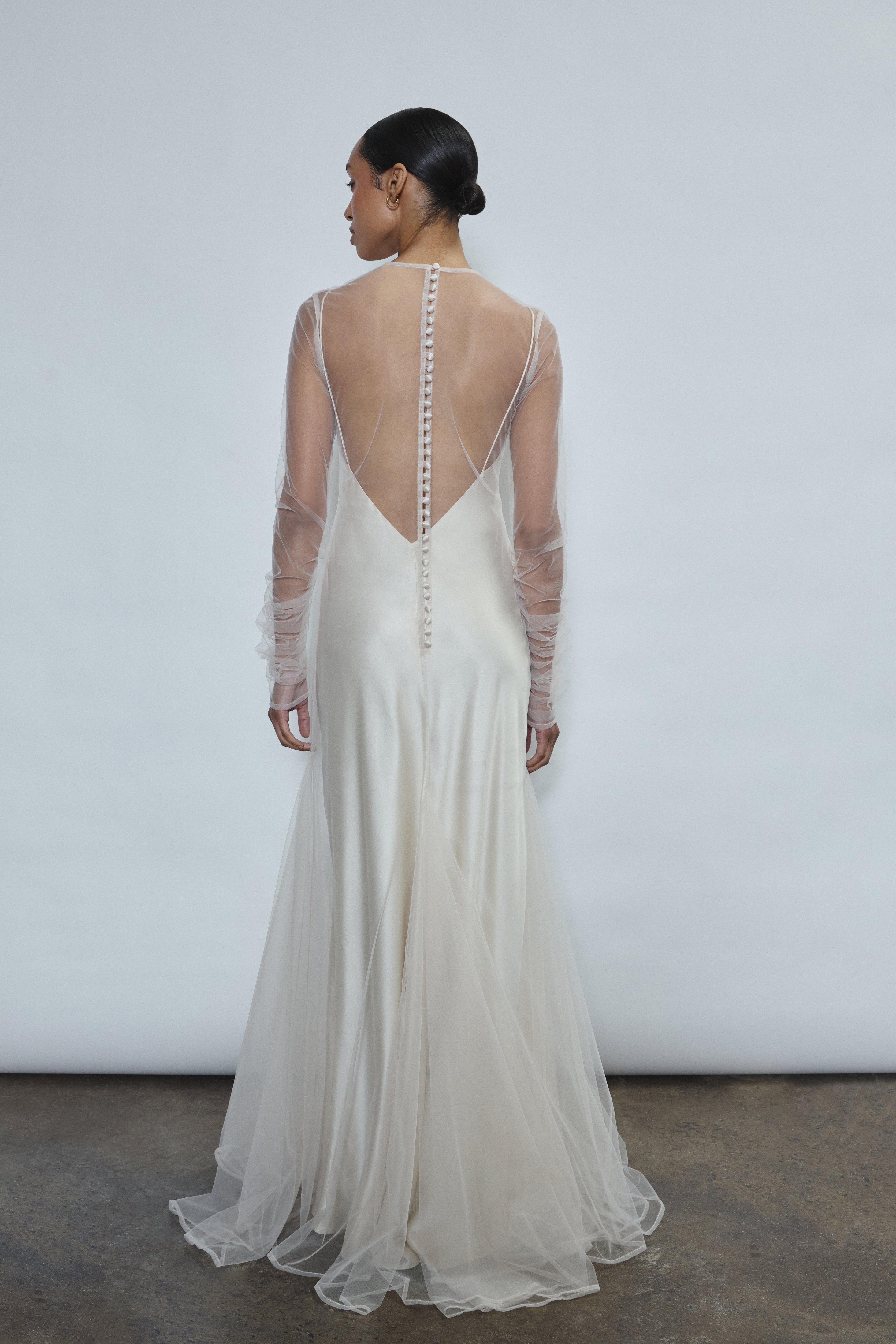 Rear view of ivory Violette Tulle Sheath showing extended button closure at center back. Architectural construction, handcrafted in California from 100% tulle.