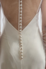 Rear view of ivory Violette Tulle Sheath showing extended button closure at center back. Architectural construction, handcrafted in California from 100% tulle.